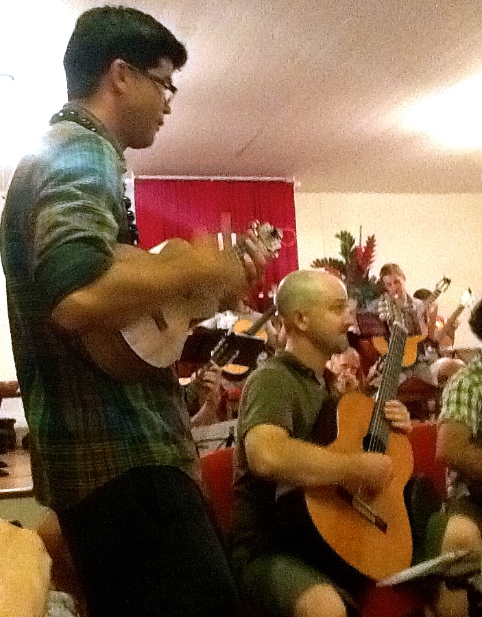 Ian O'Sullivan performing on ukulele with the Maui Honu Guitar Orchestra (2014)