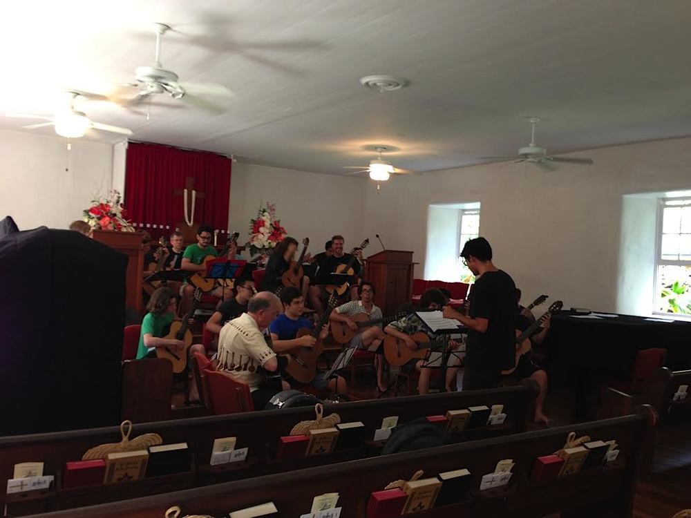 Ian O'Sullivan rehearsing the guitar orchestra at Keawala'i Church, Makena (2013)